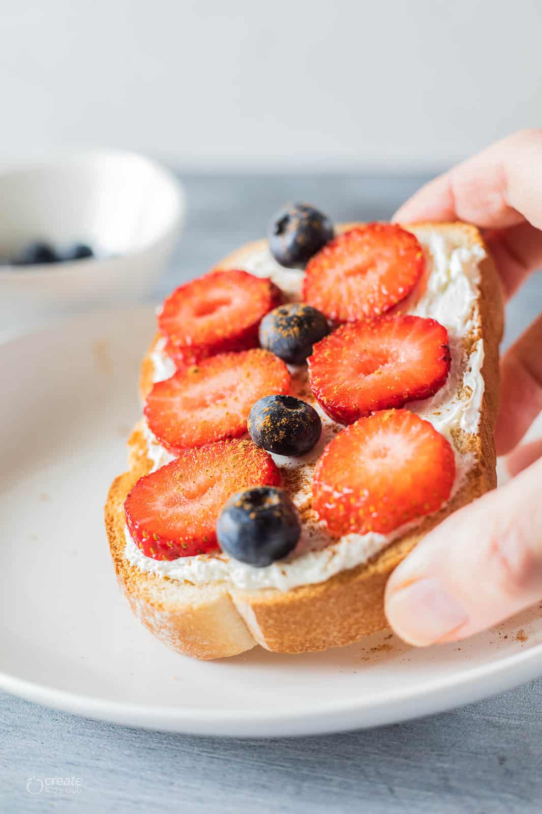 Whipped cream cheese and berries on toast