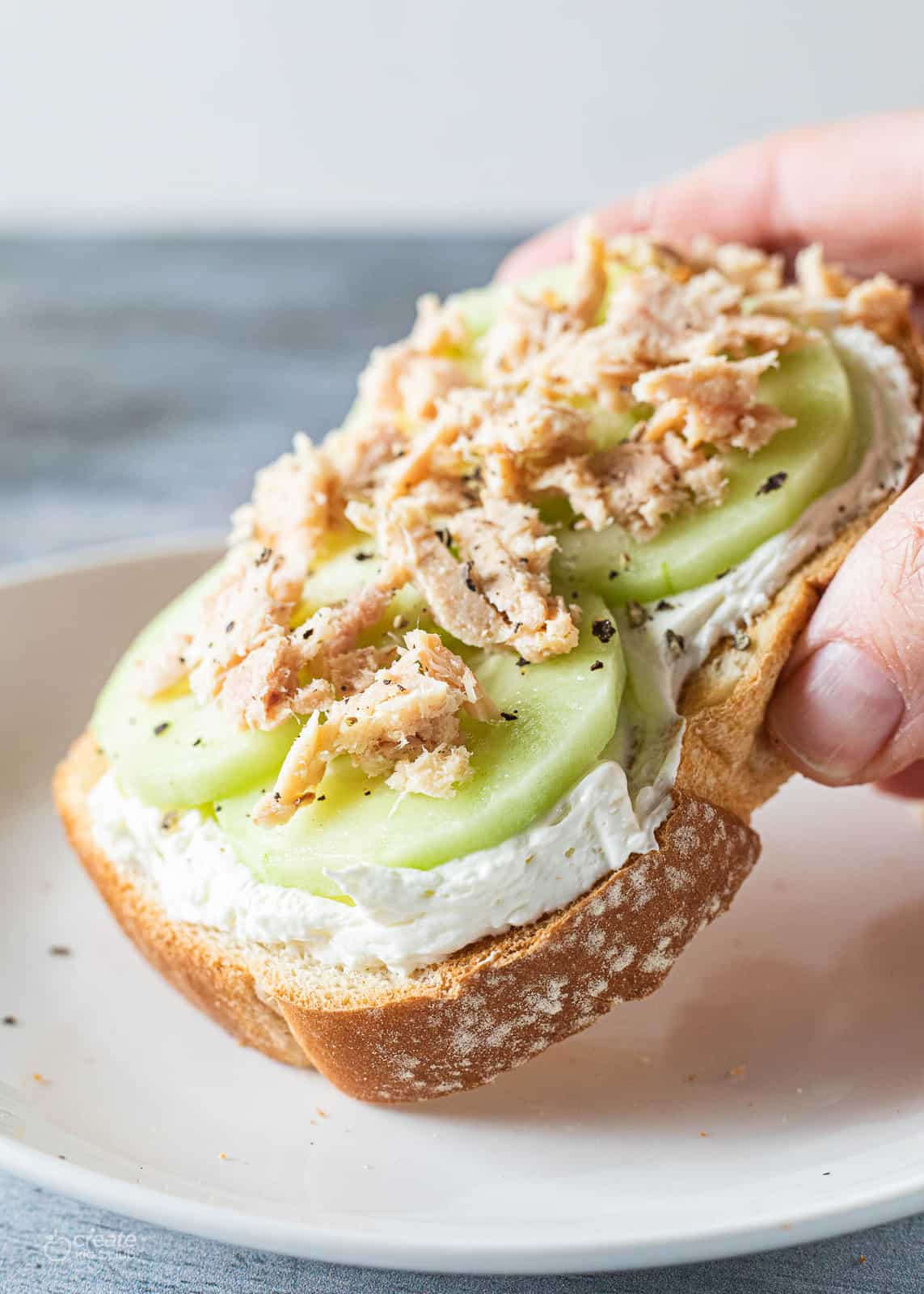 cream cheese, cucumber slices and tuna on toast