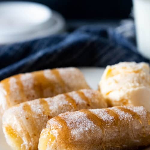 caramel drizzled over banana spring roll