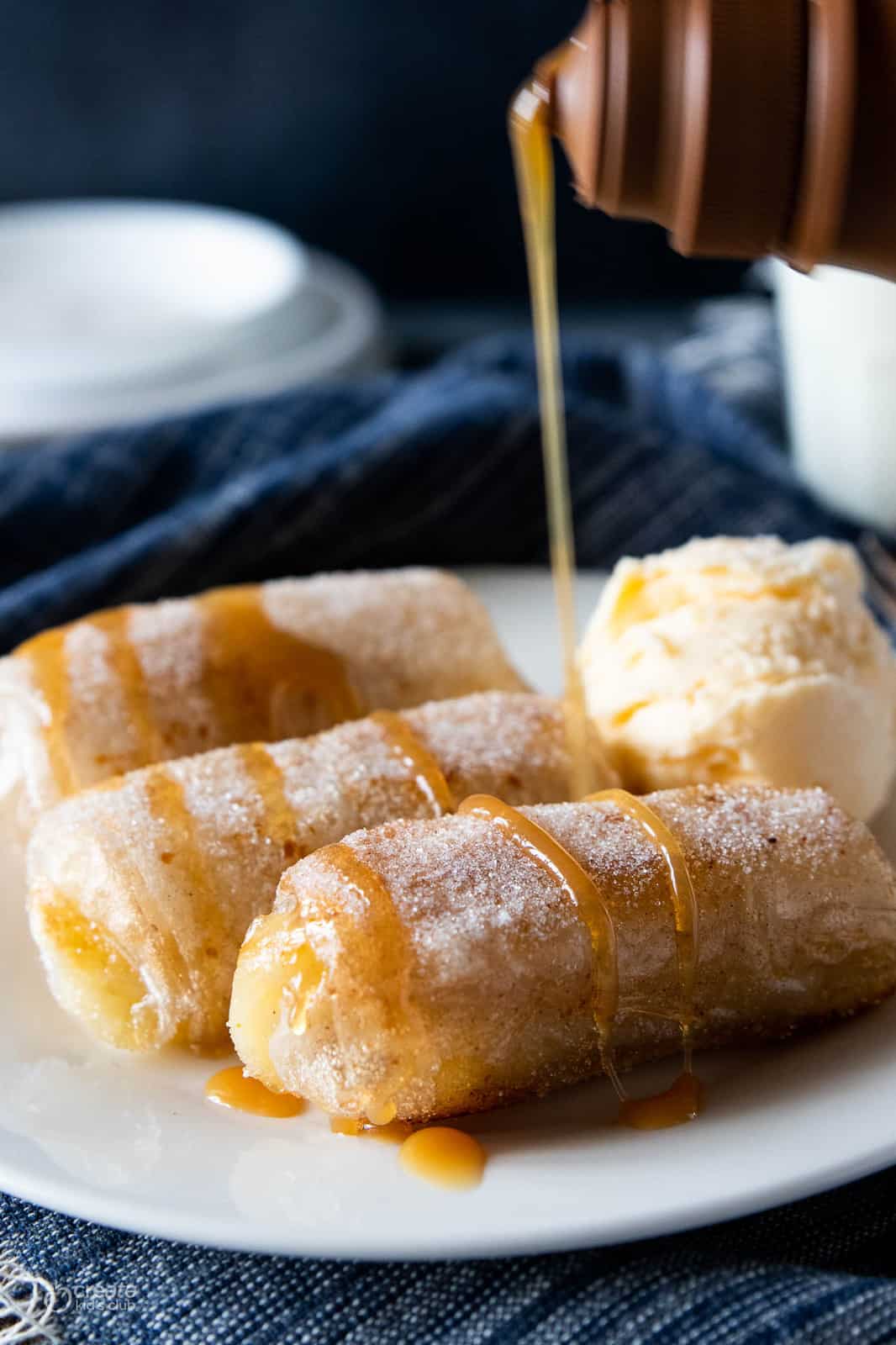 caramel drizzled over banana spring roll