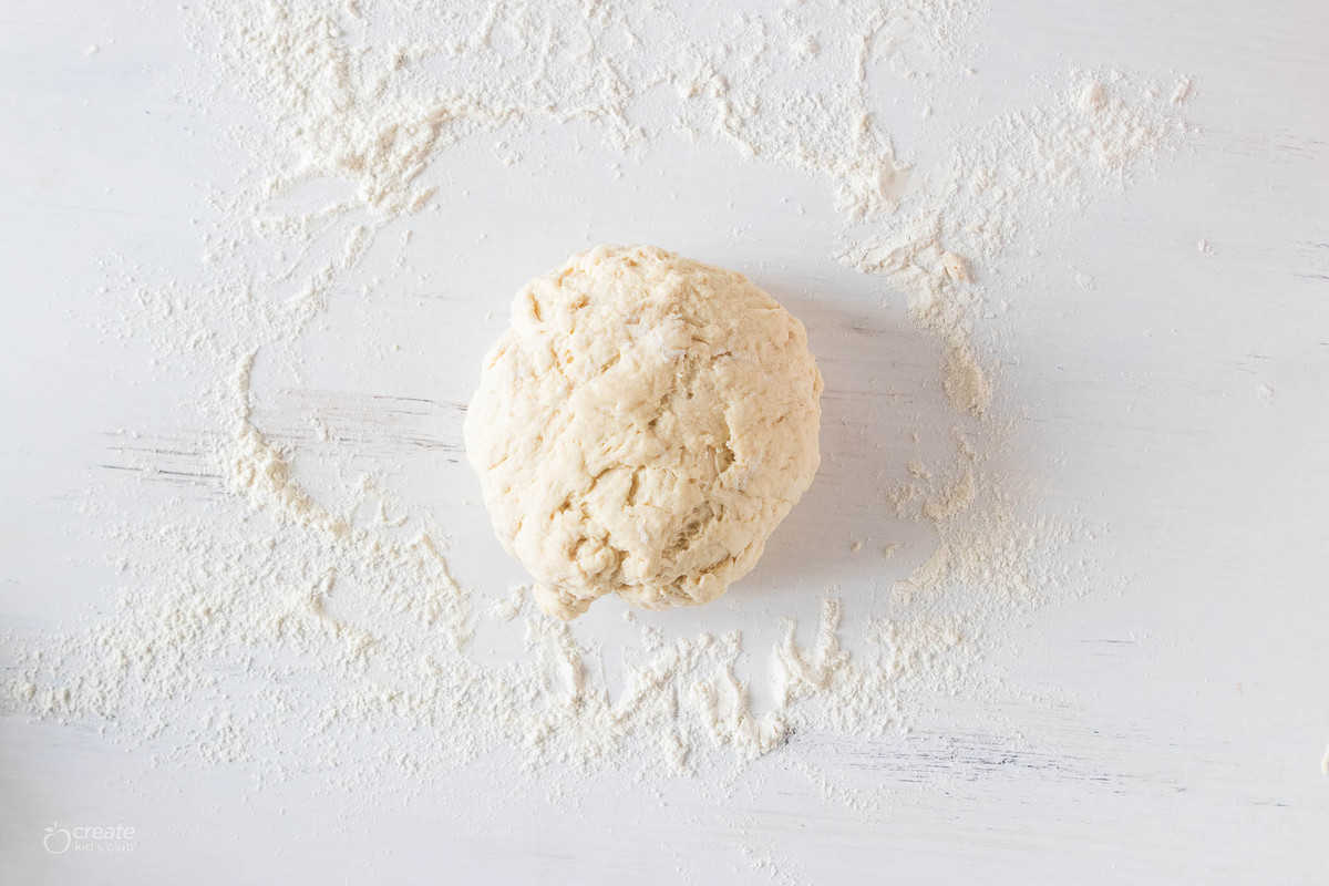 bread dough on floured surface
