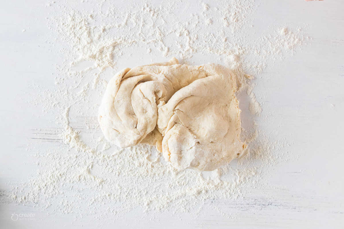 bread dough on floured surface