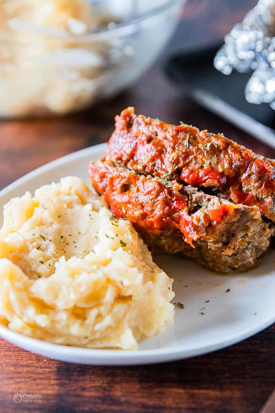 meatloaf on plate with mashed potatoes