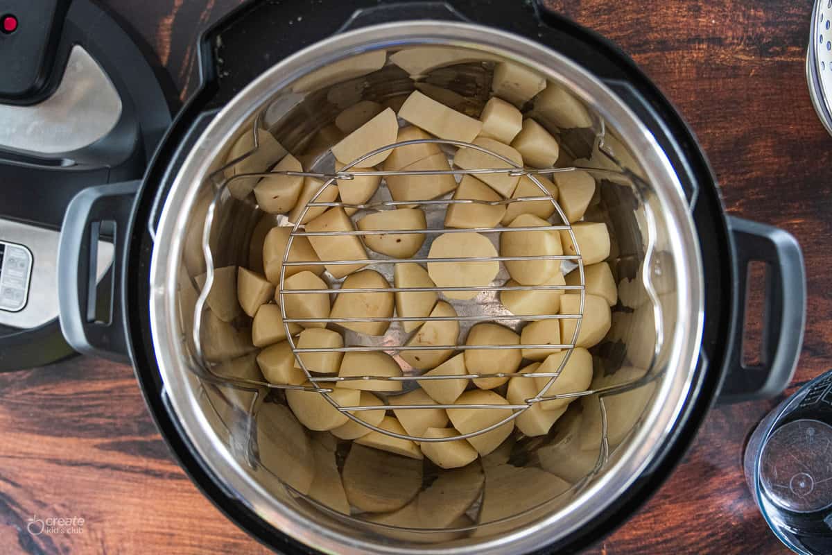 chopped potatoes at bottom of instant pot
