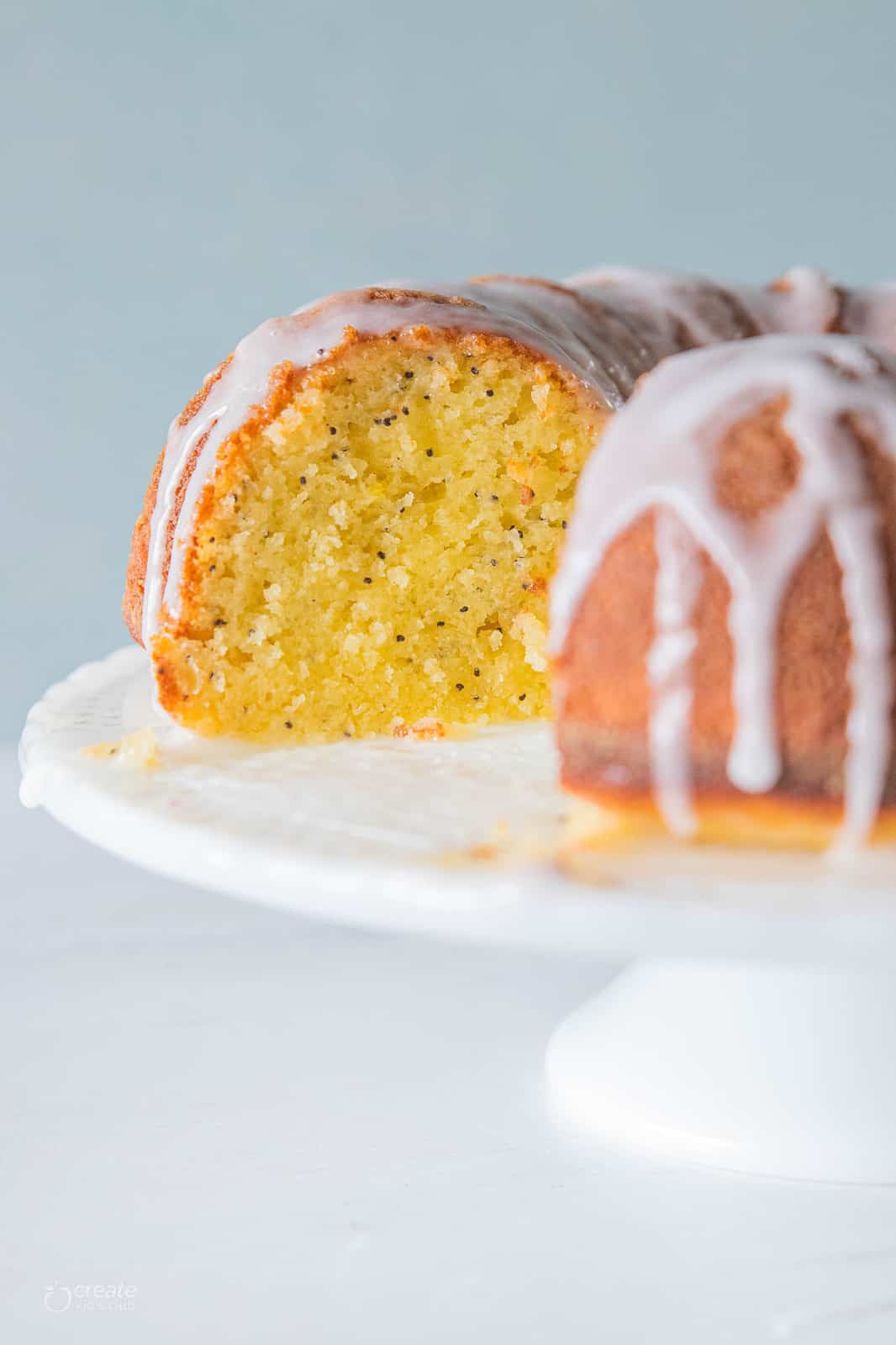 lemon poppyseed bundt cake drizzled with icing