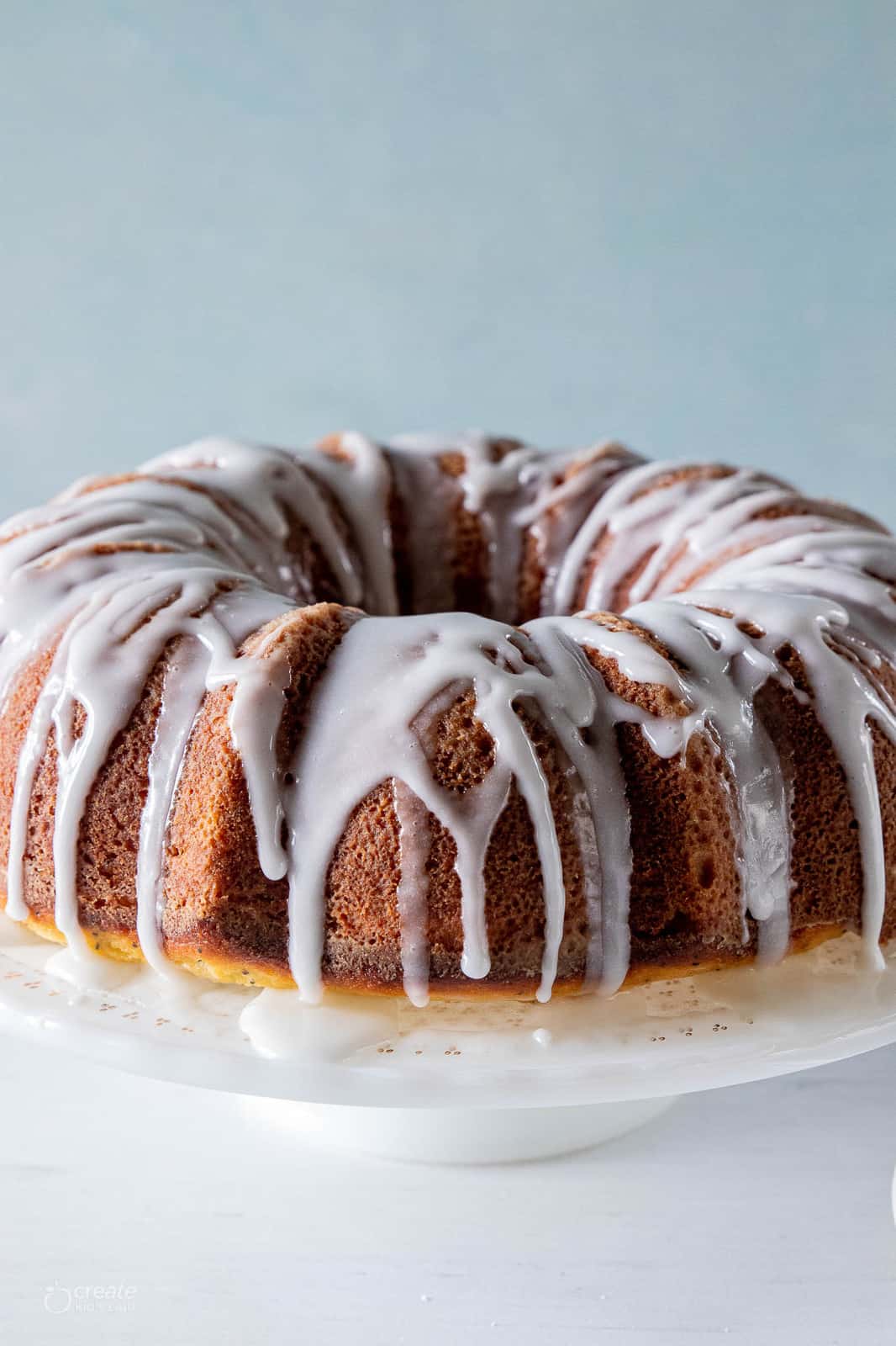 lemon poppyseed bundt cake drizzled with icing