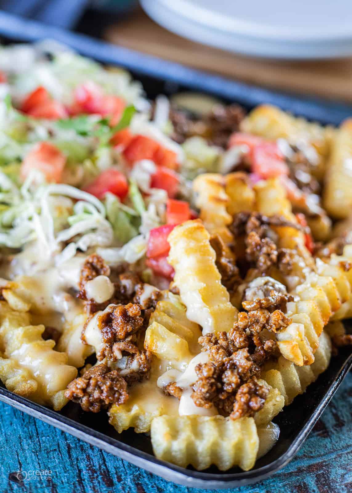 fries topped with taco meat and toppings
