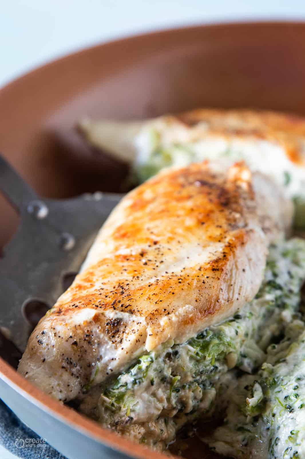 broccoli and cheese stuffed chicken breast in pan