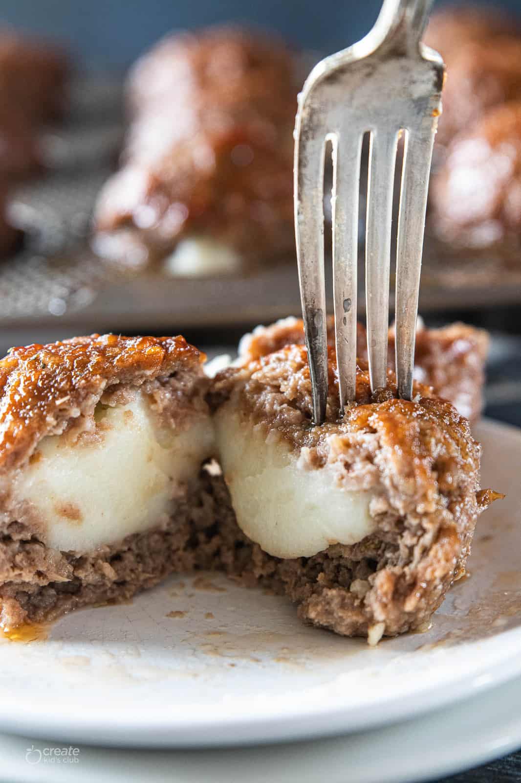 fork scooping into meatloaf