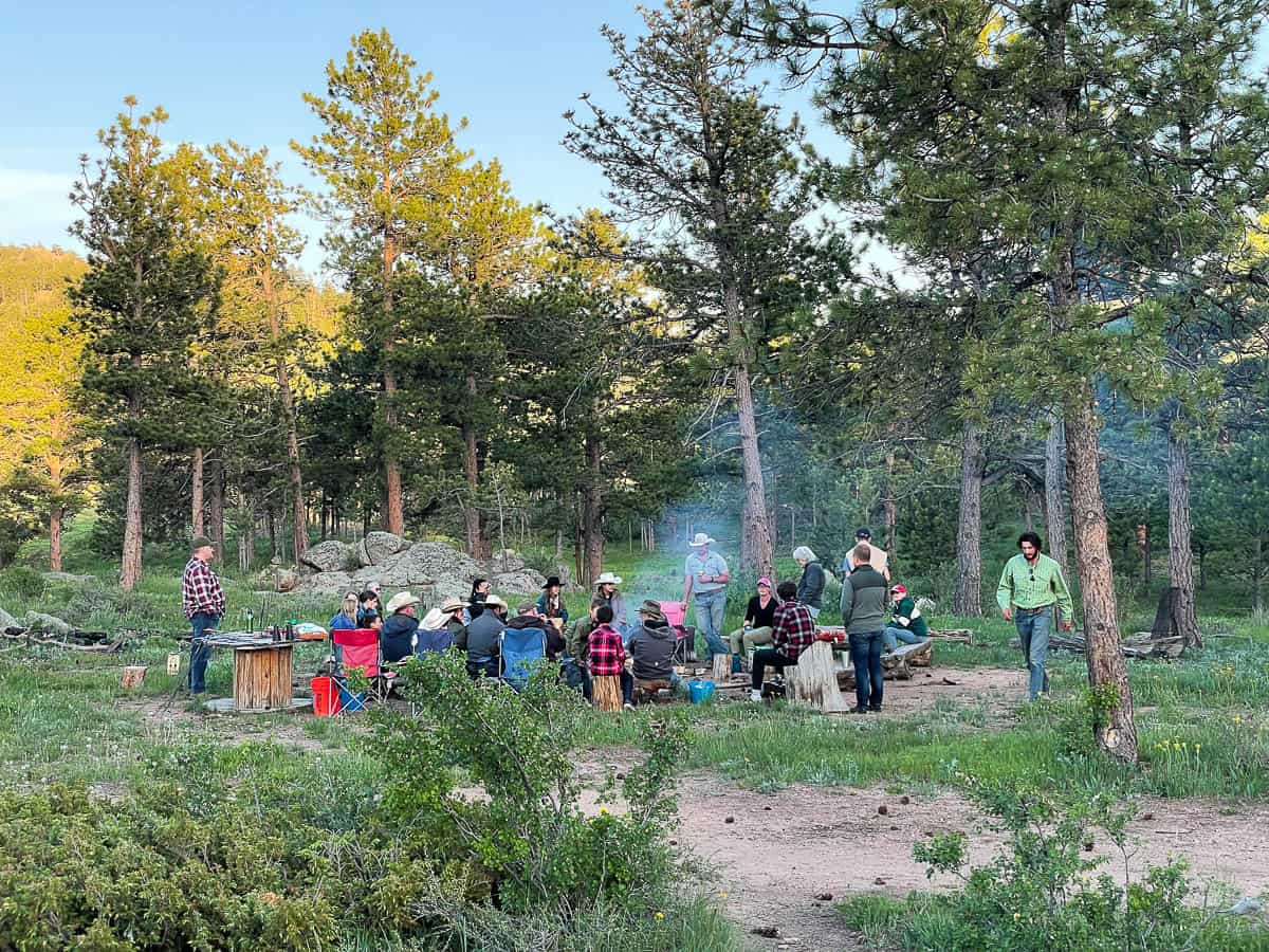 families gathering around campfire