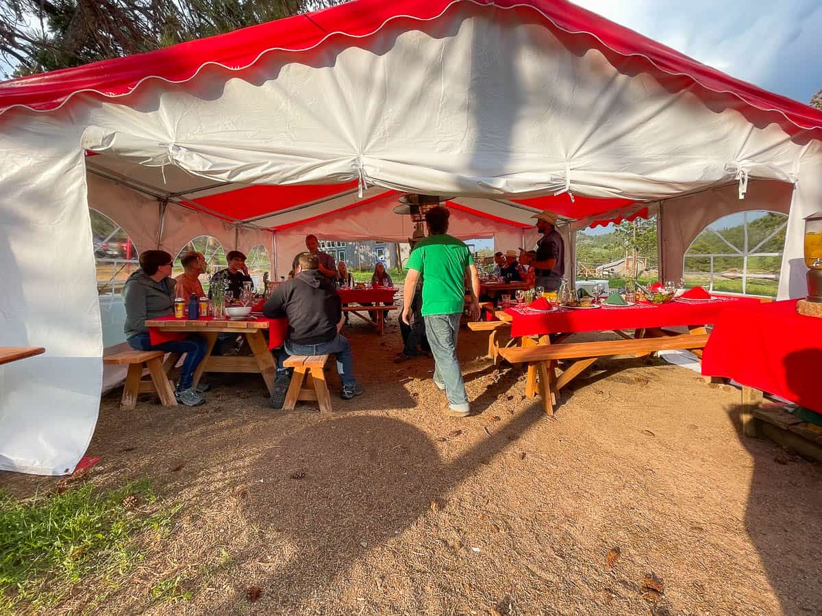 ranch guests dining in outdoor tent