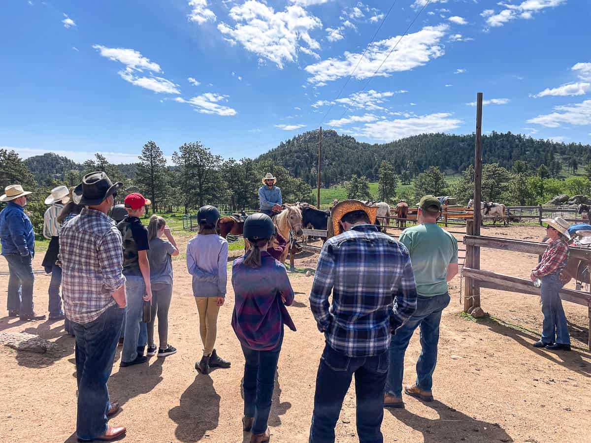 ranch guests at a horse riding lesson