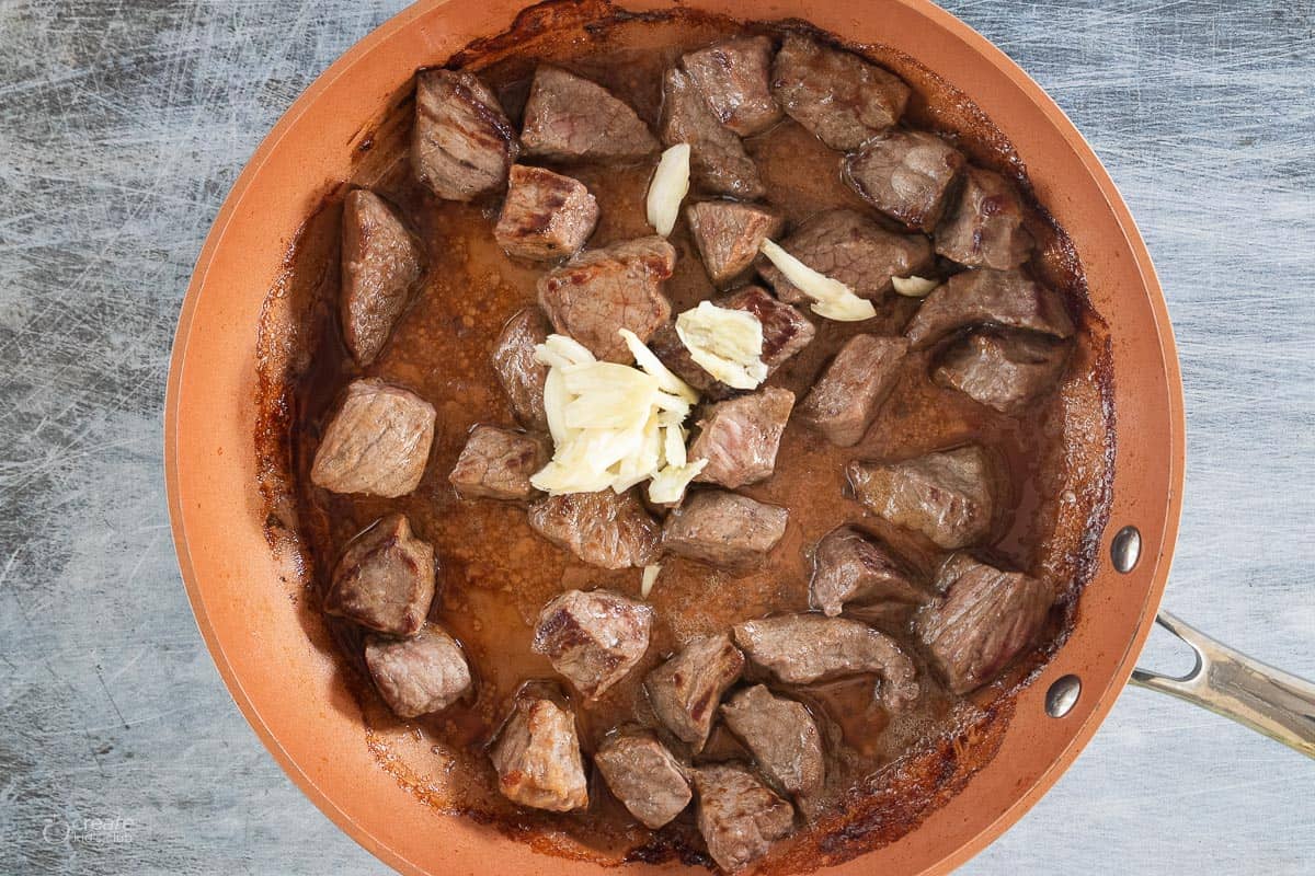 browned stew meat in pan
