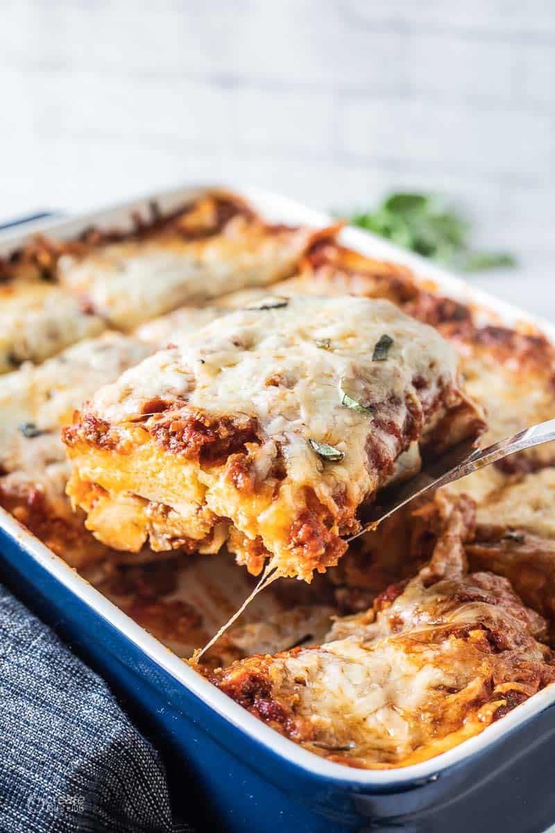 sliced lasagna in baking dish