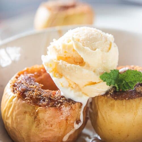 baked apples topped with scoop of vanilla ice cream
