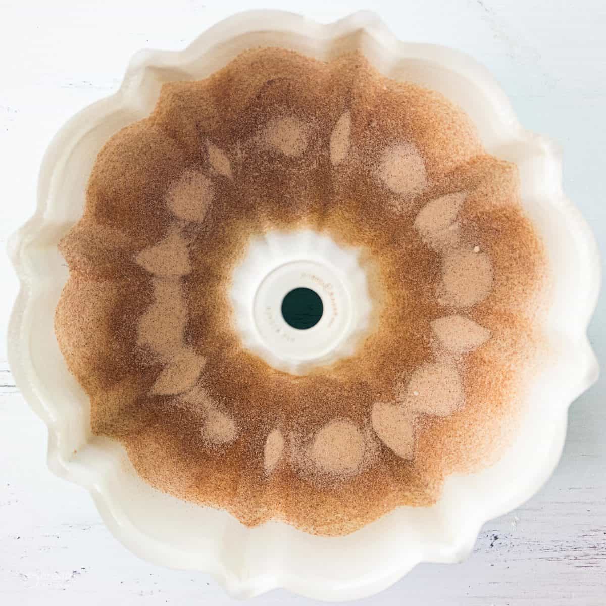 bundt pan coated with cinnamon and sugar