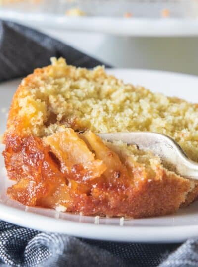 fork slicing into gluten free apple cake