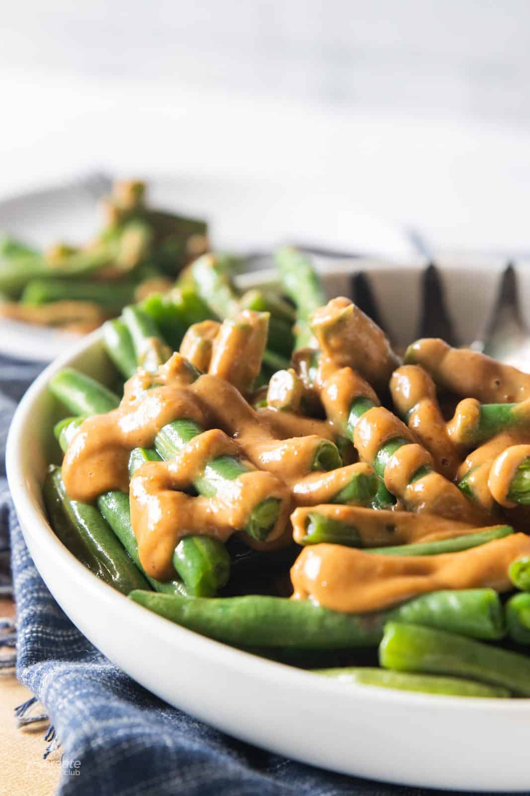 peanut sauce drizzled over green beans