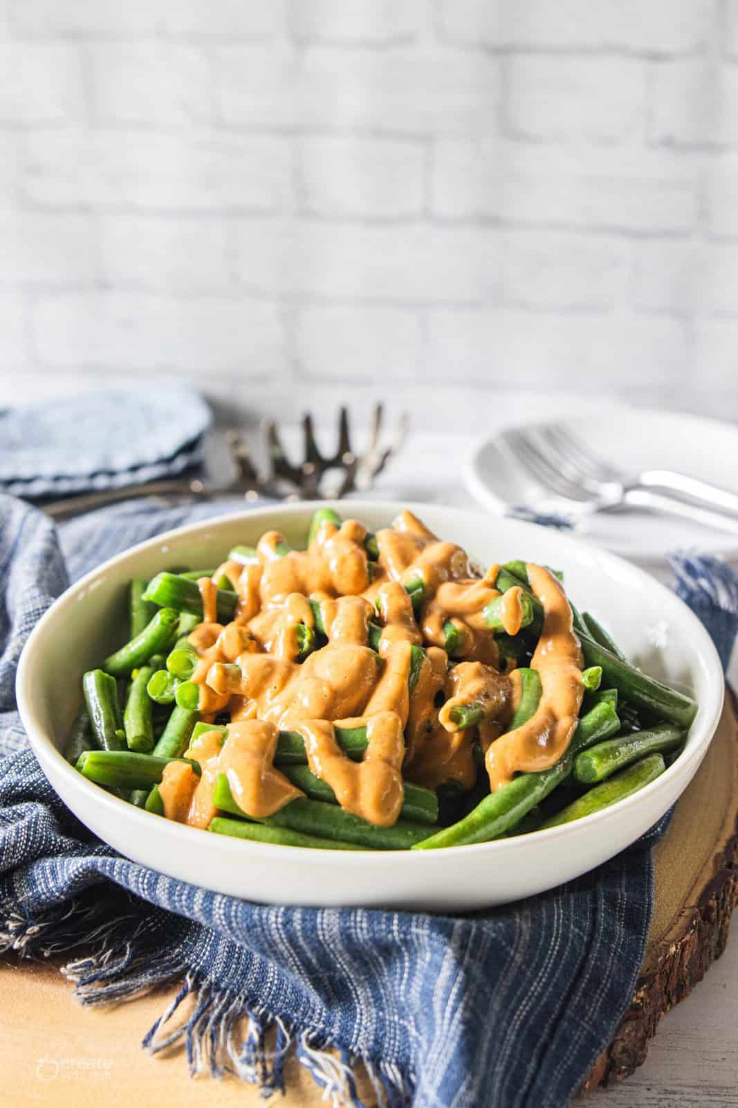 peanut sauce drizzled over green beans