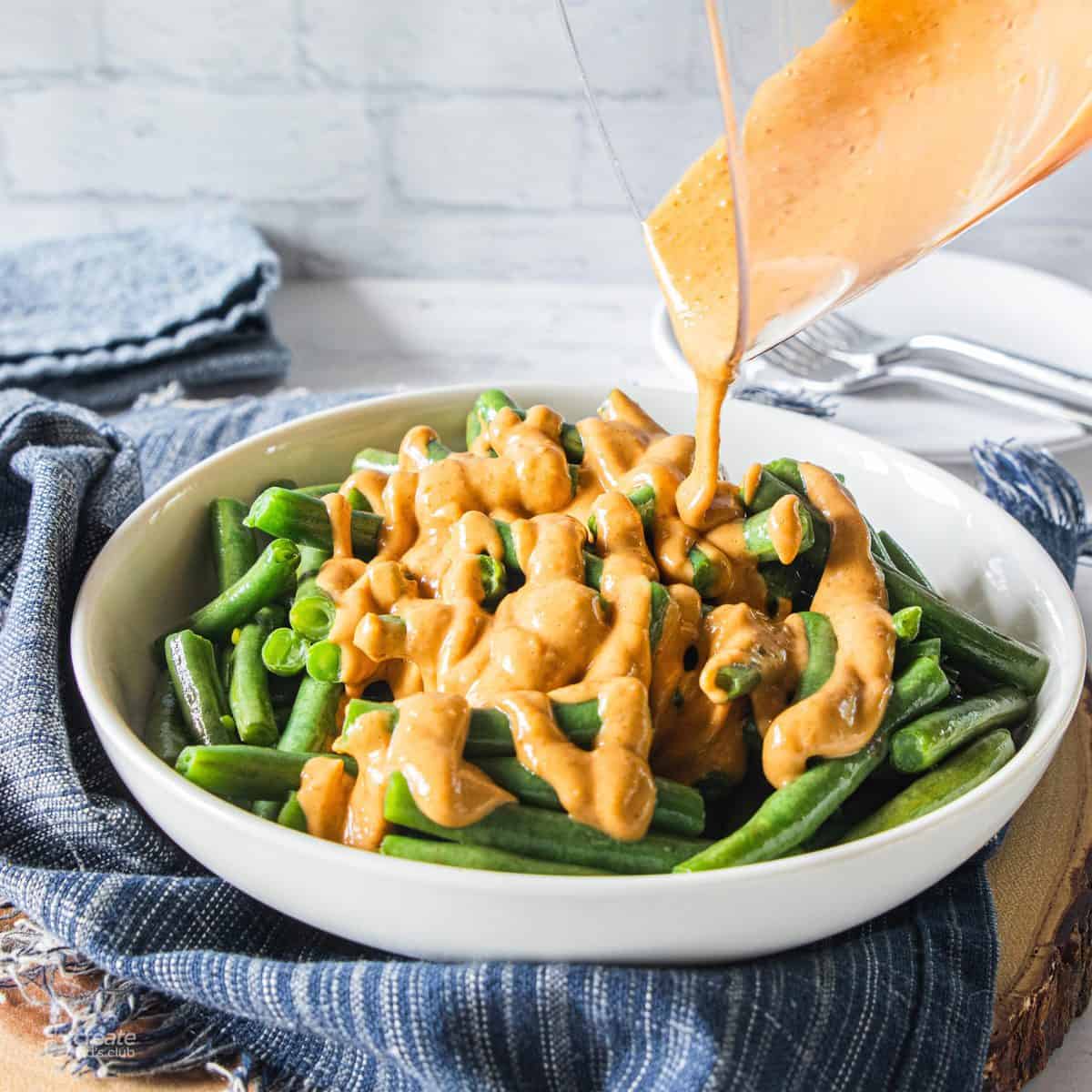 peanut sauce drizzled over green beans