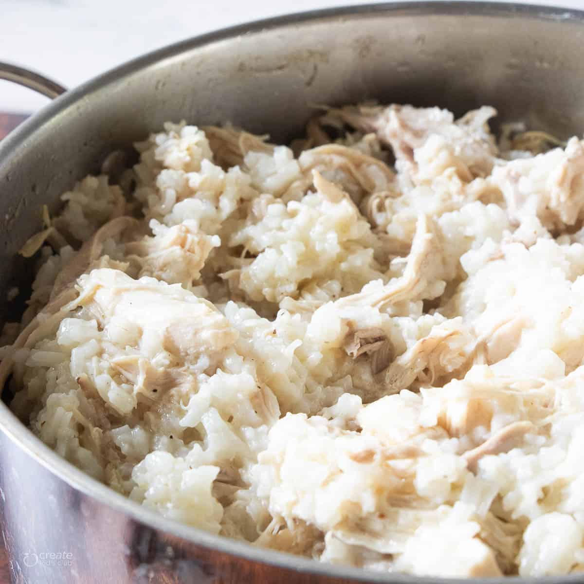 boiled chicken and rice in pan