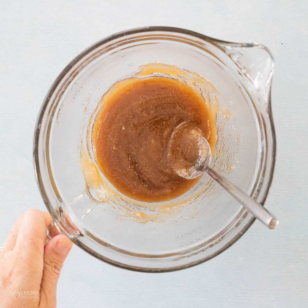 brown sugar and honey mixture stirred in bowl