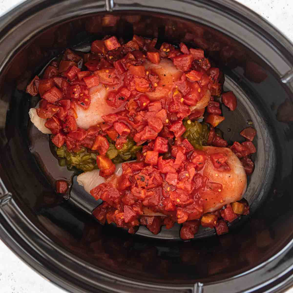 chicken, canned tomatoes and green chilis in crockpot