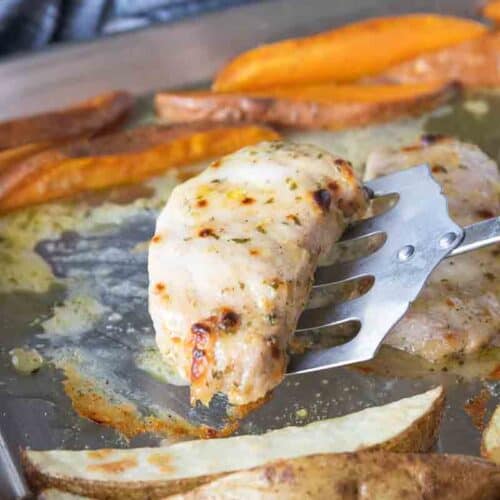 pork chop scooped by spatula from sheet pan