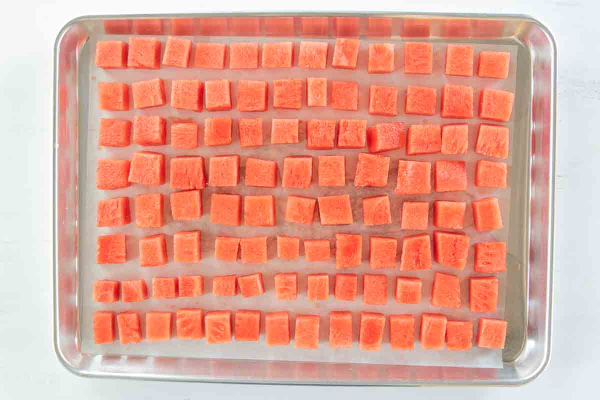 diced watermelon on a baking tray