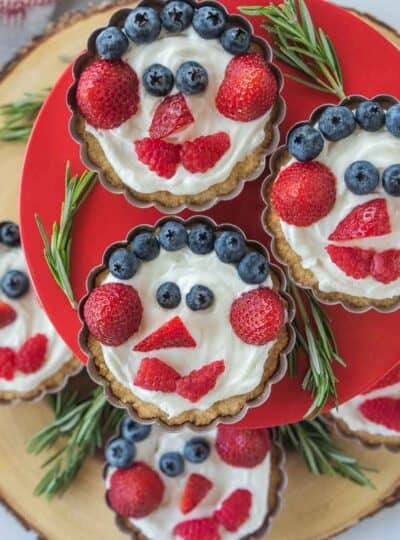 closeup view of Christmas fruit tarts stacked on stand