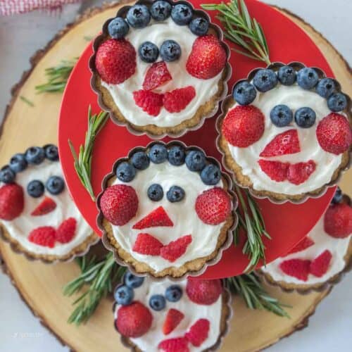 closeup view of Christmas fruit tarts stacked on stand