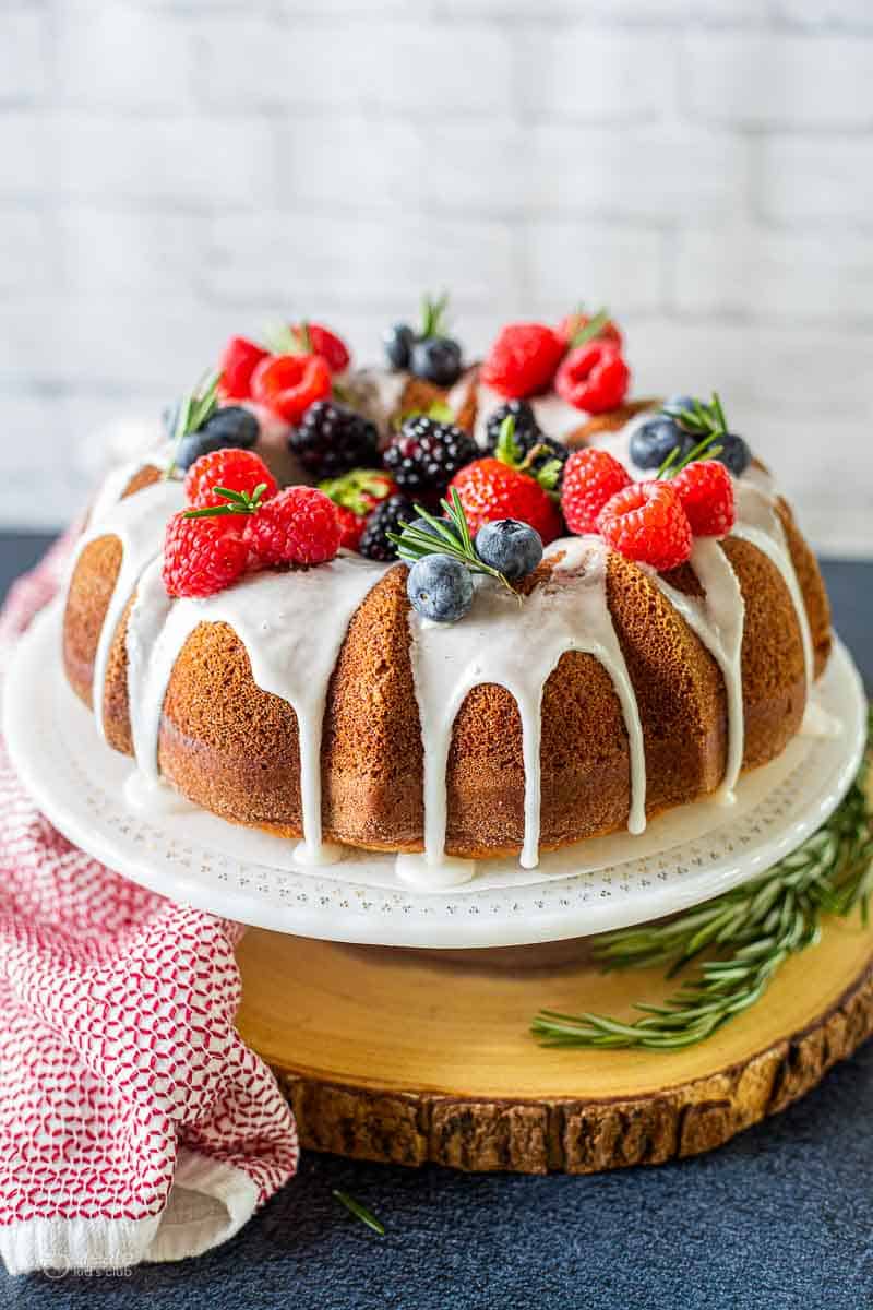 Bundt cake drizzled with icing and topped with berries