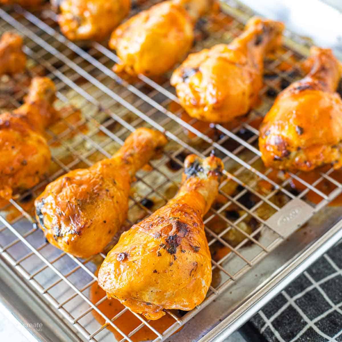 buffalo chicken leg baked on a wire rack