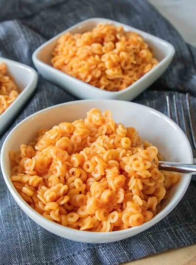 gluten free spaghettios in bowl with fork