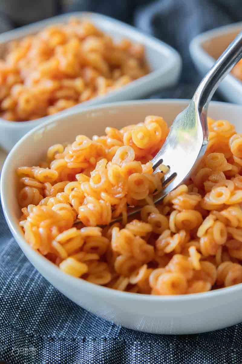 fork scooping up a bite of gluten free spaghettios