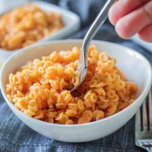 gluten free spaghettios in a bowl with a fork