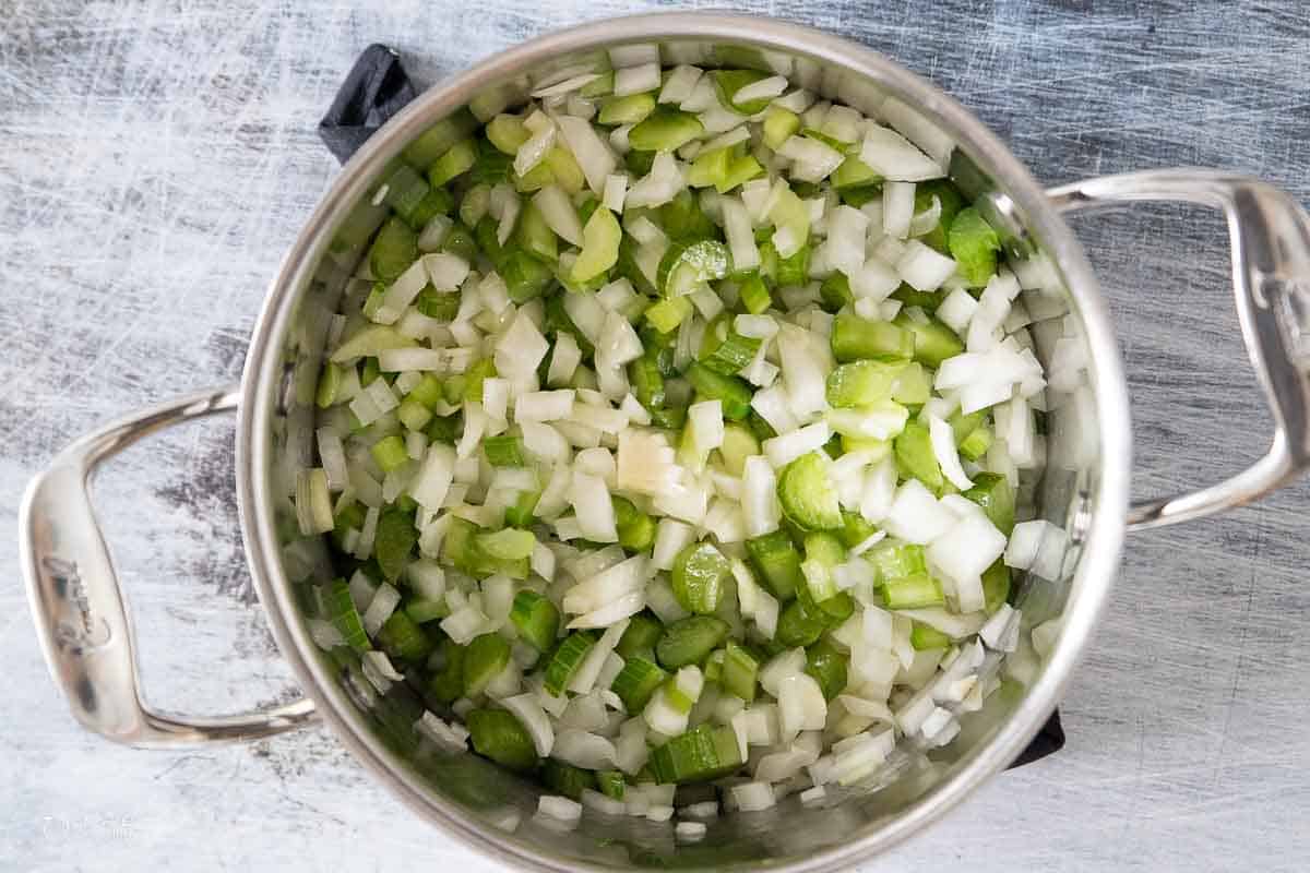 diced onion and celery in a stock pot