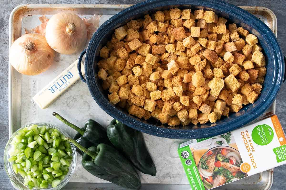 ingredients for gluten free cornbread stuffing on a sheet pan