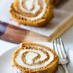 slice of pumpkin roll on serving plate with fork