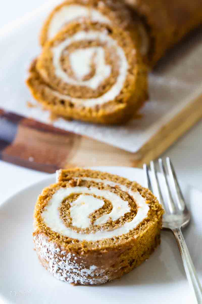 slice of pumpkin roll on serving plate with fork