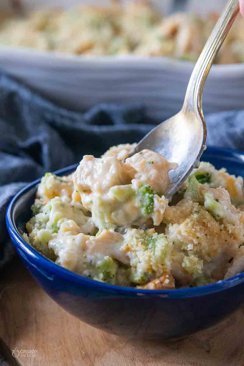 spoon in a serving bowl filled with chicken casserole