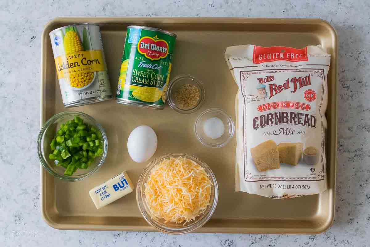 ingredients for corn casserole on a sheet pan
