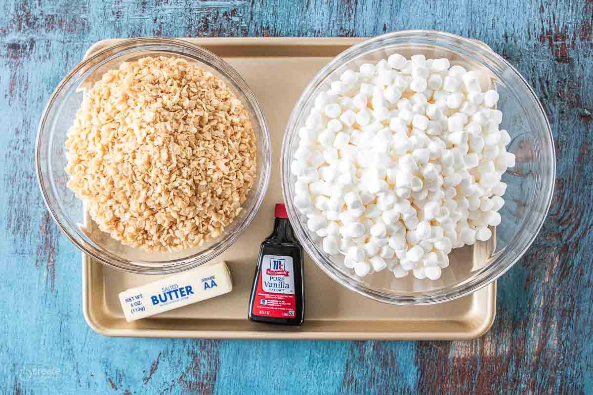 rice Krispies, butter, vanilla extract and marshmallows on a sheet pan