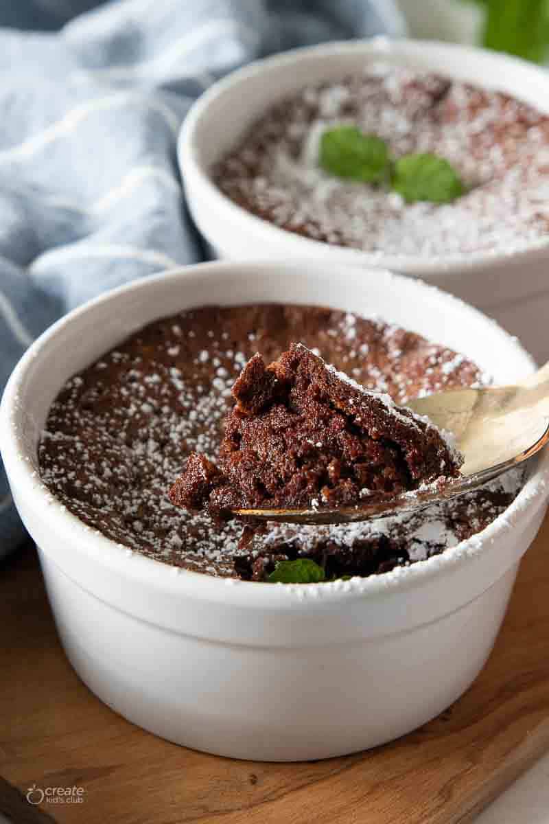 spoon scooping into flourless chocolate cake