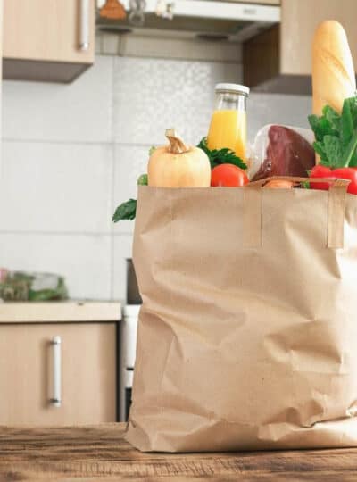 A bag of groceries on a counter cropped square.