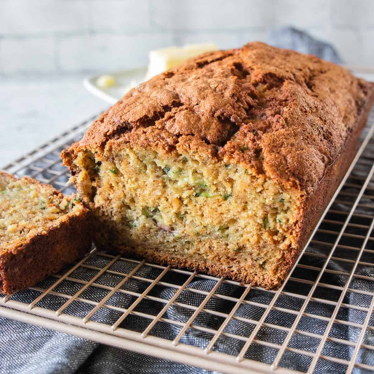 loaf of gluten free zucchini bread on a wire cooling rack