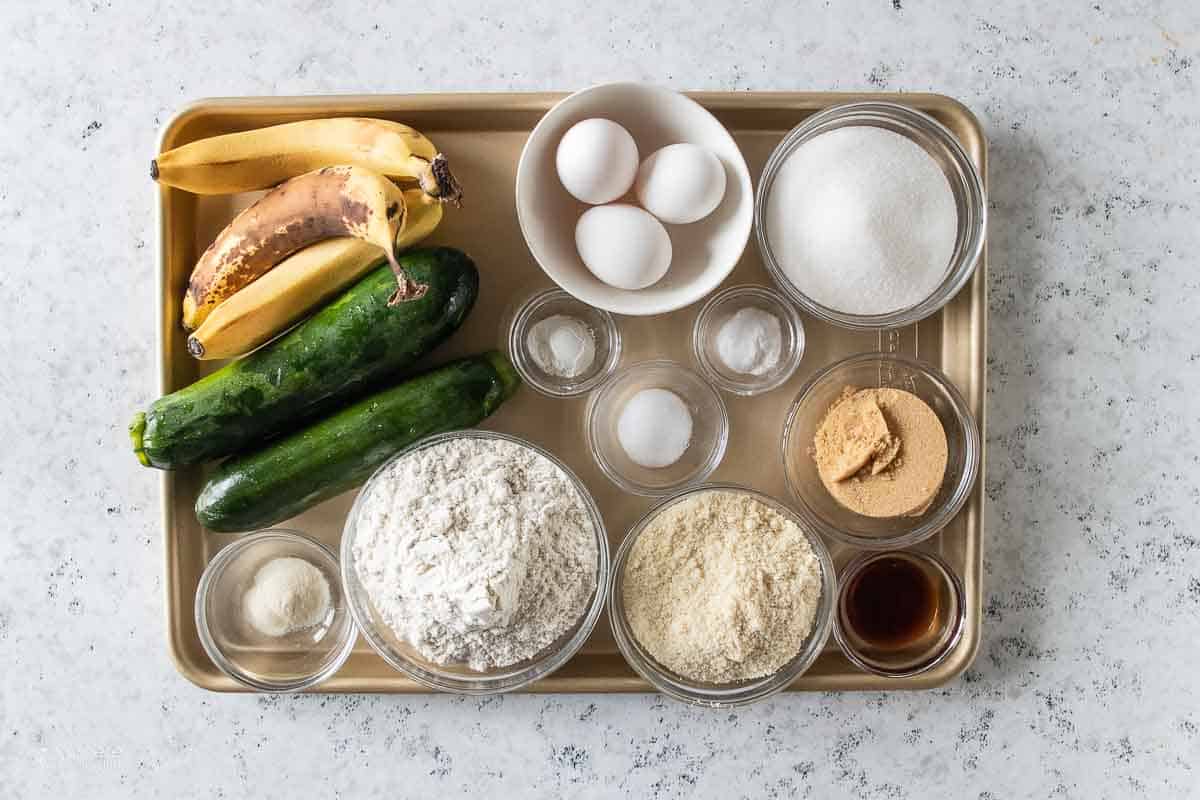 ingredients for gluten free zucchini bread on a sheet pan