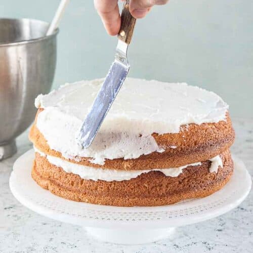 both layers of white cake spread with white icing