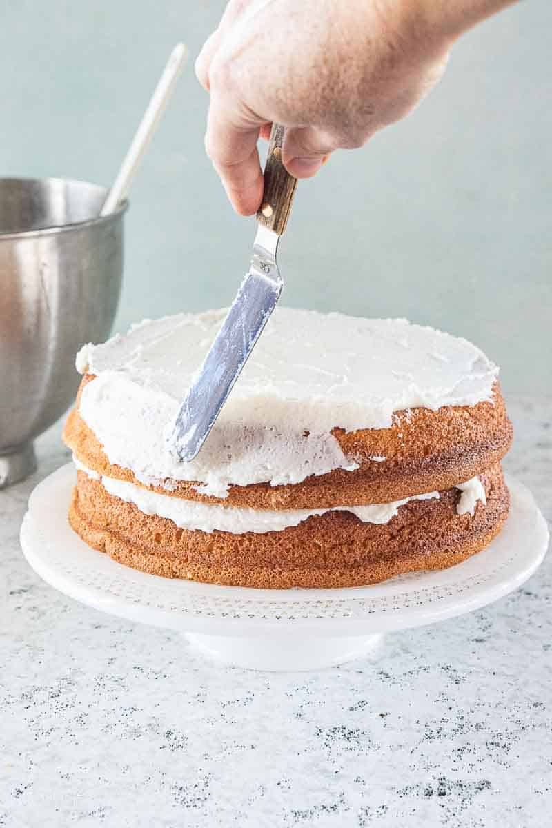both layers of white cake spread with white icing