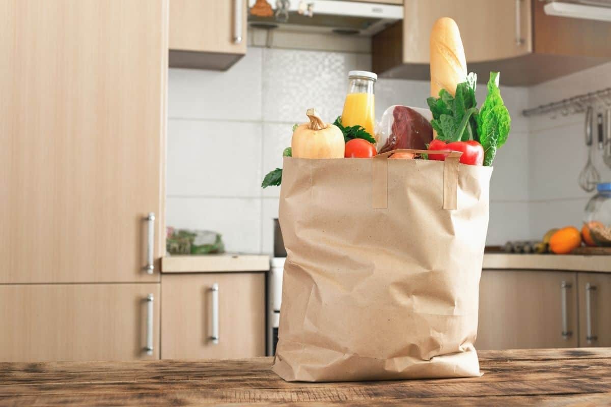 A bag of groceries on a counter.